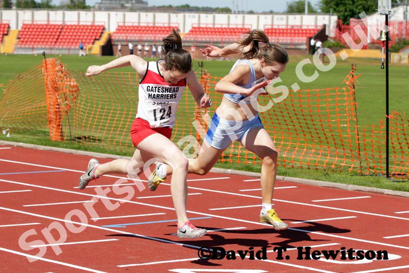 Lauren Beales (Gateshead) beats Charlotte Patterson (Middlesbrough Mandale) in a photo finish under-13s 200 metres.